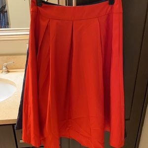 Red pleated skirt - zipper closure in back